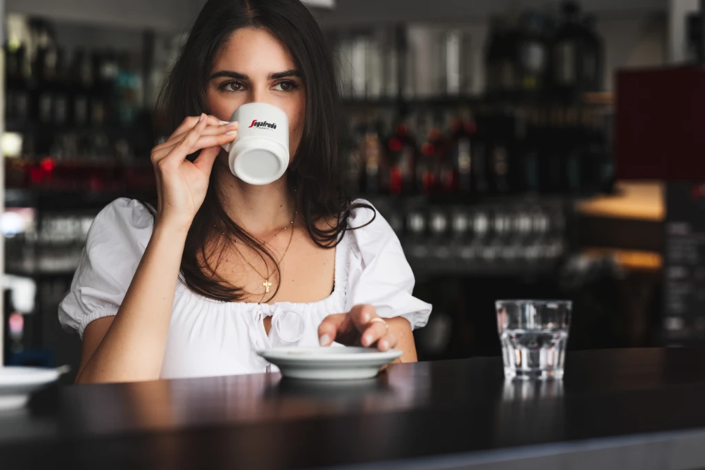 Women drinks segafredo coffee.jpg